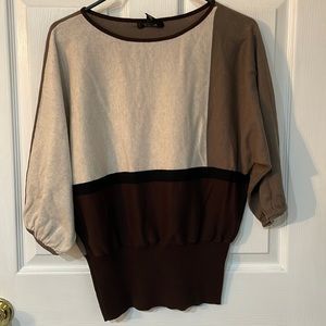 Women’s sweater with 3/4 length sleeve. Tan, brown and black colored